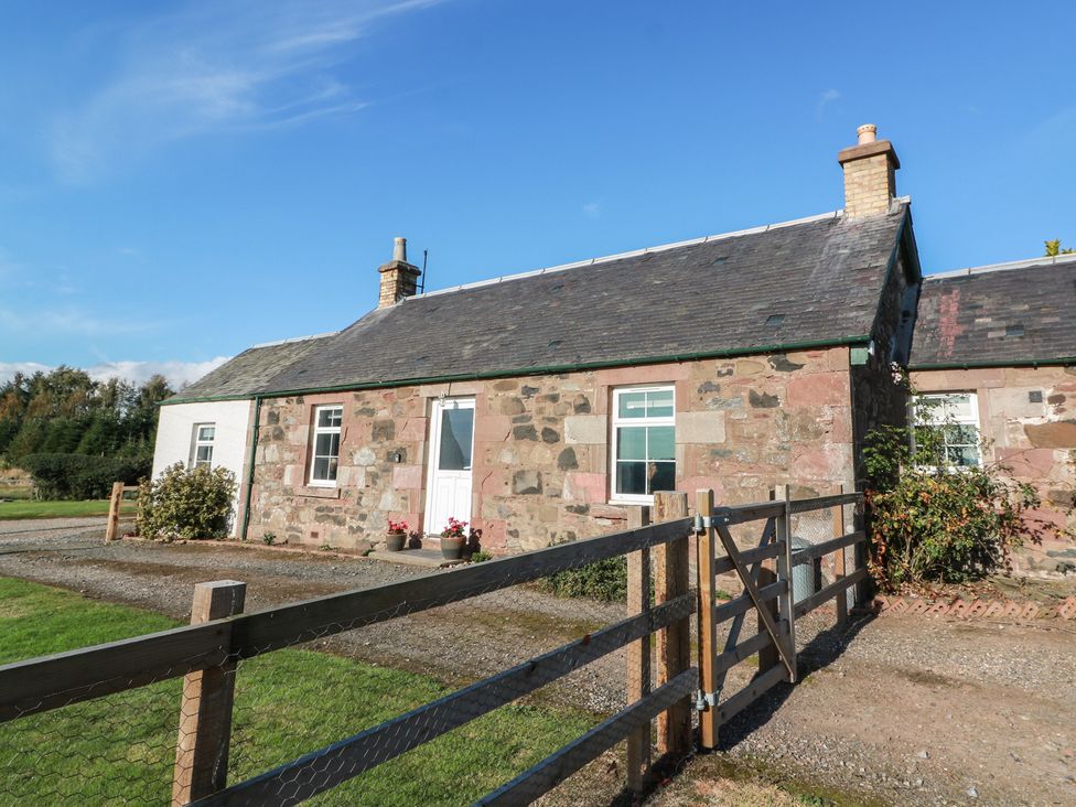 A house with a gate and garden area at The Bothy in Blairgowrie