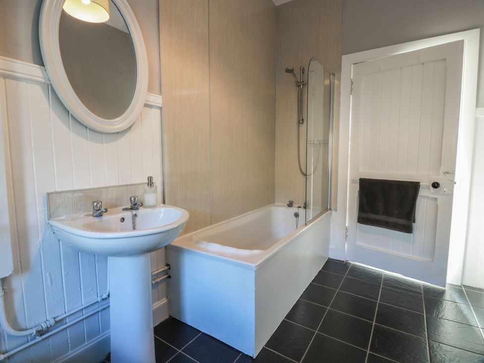 A bathroom with a sink and bathtub at The Bothy in Blairgowrie