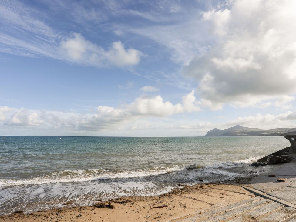 A beach scene with sand and sea at Gelli - Morfa Nefyn Morfa Nefyn