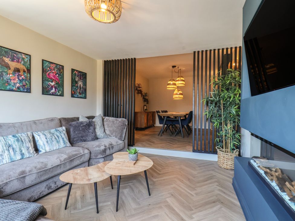 A living room with a sofa and coffee table at Falcon Luxe in Whitby