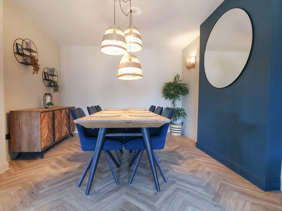 A dining room with a table and chairs at Falcon Luxe in Whitby