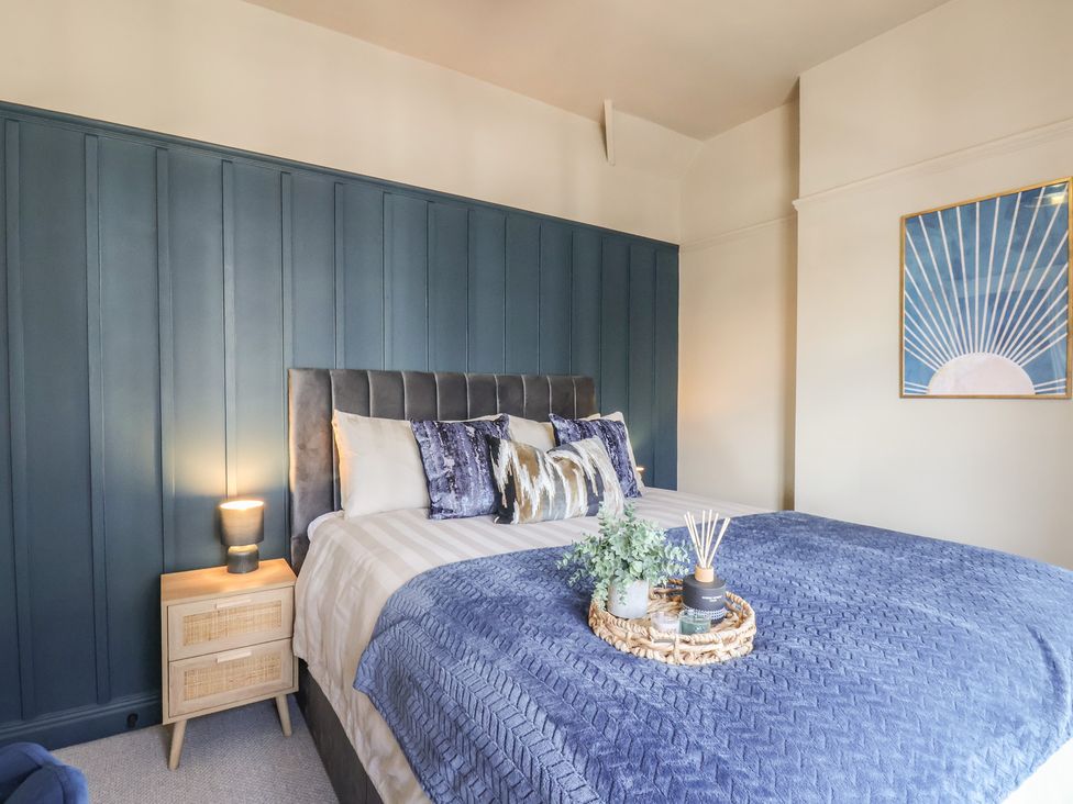 A bedroom with a bed and decorative items at Falcon Luxe in Whitby