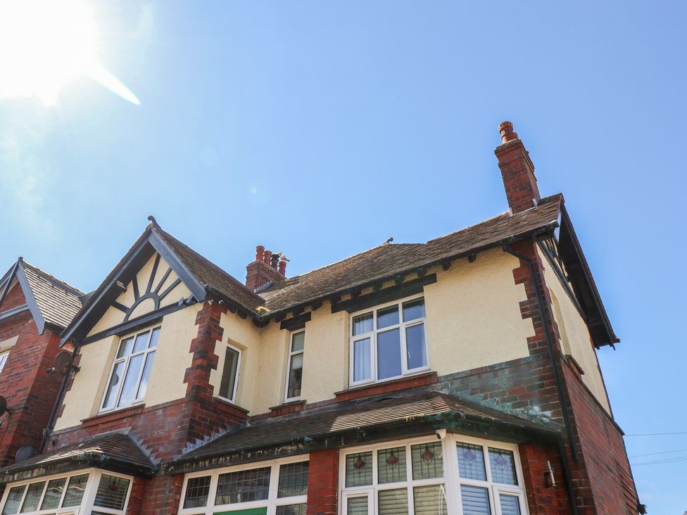 An exterior view of a house with a chimney and windows at Falcon Luxe in Whitby