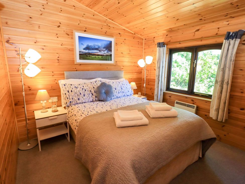 A bedroom with bed and bedside table at Watendlath in Keswick
