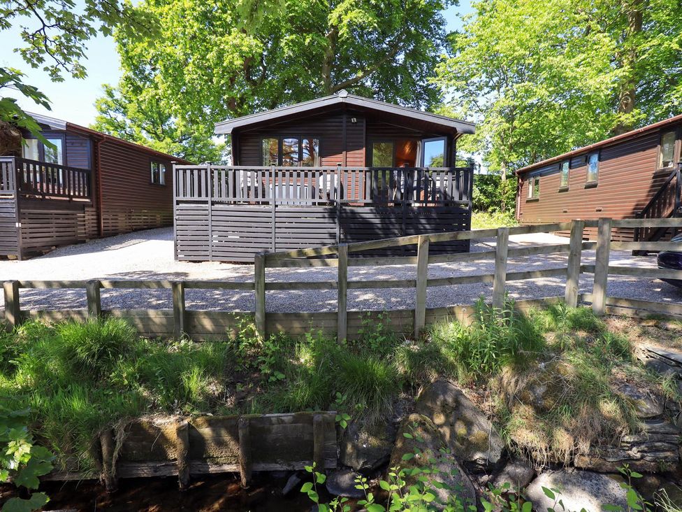 A cabin with a deck and gravel path at Watendlath in Keswick