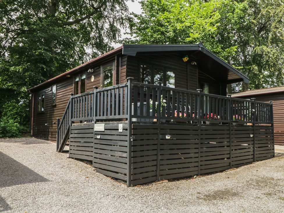 A cabin with a deck and parking area at Watendlath in Keswick