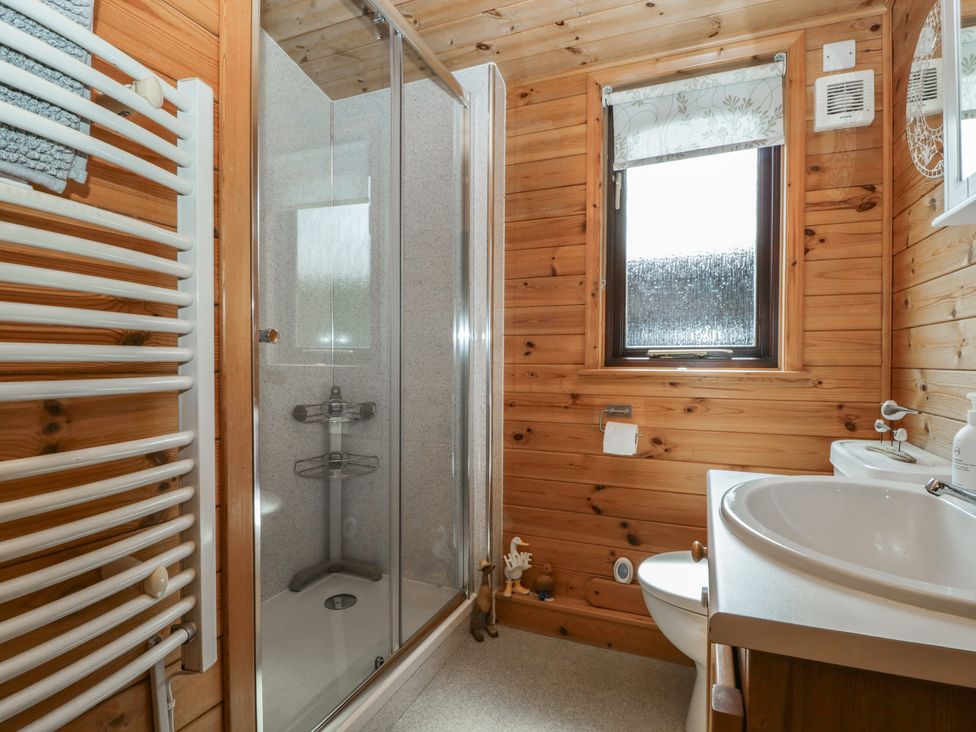 A bathroom with shower and sink at Watendlath in Keswick