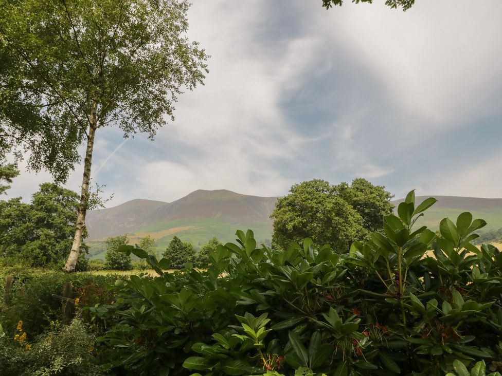 A view of mountains and trees in the outdoors at Watendlath in Keswick