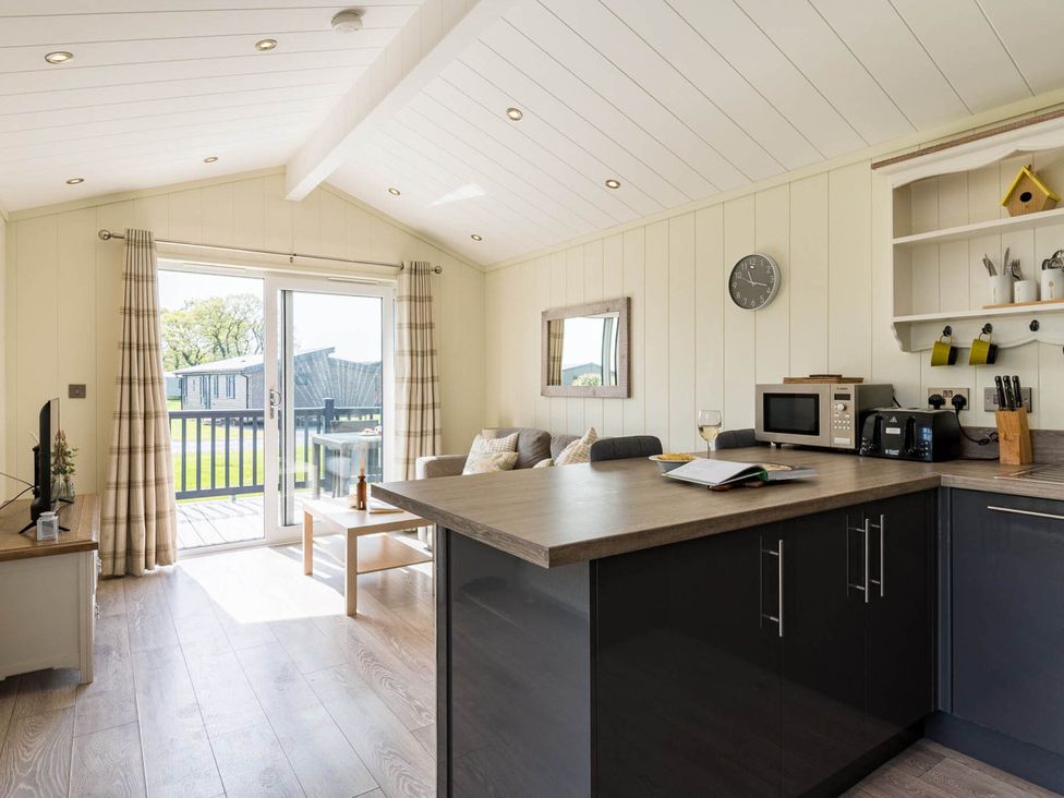 A kitchen and living room area with a view at Stokesley in Great Ayton