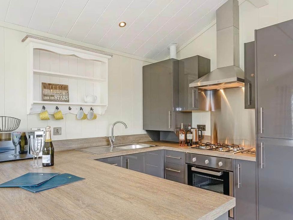 A kitchen with cabinets and appliances at Stokesley in Great Ayton
