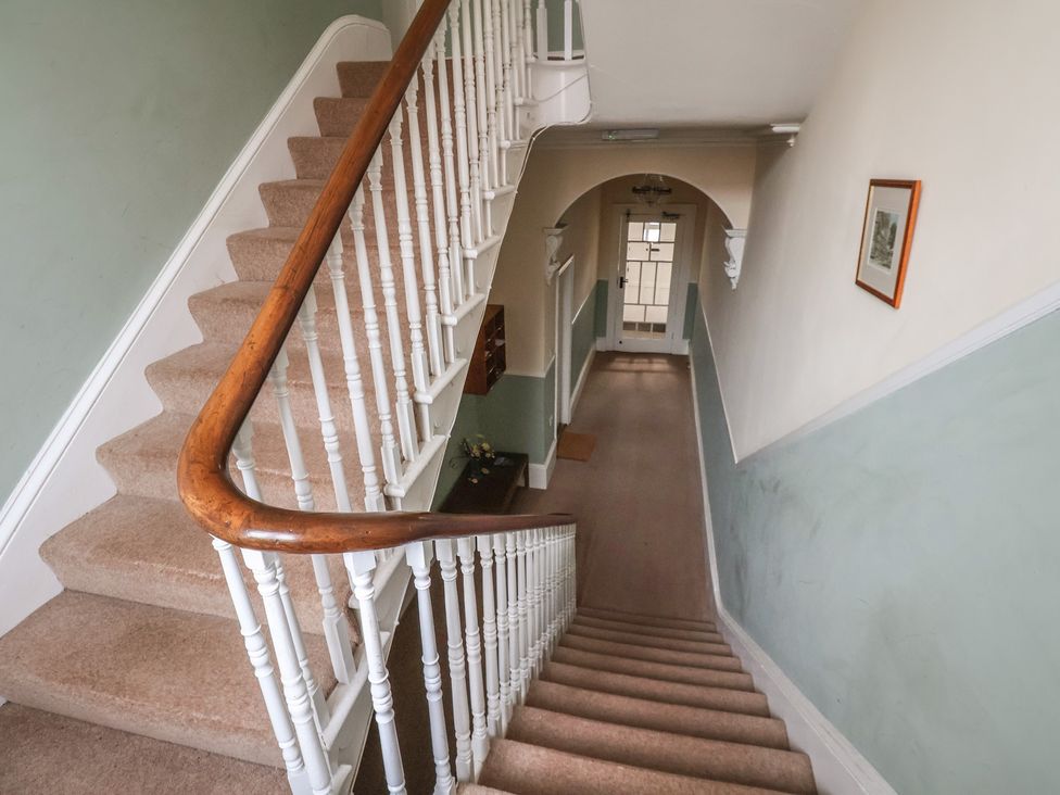 A staircase and corridor view at The Studio on the Crescent Whitby