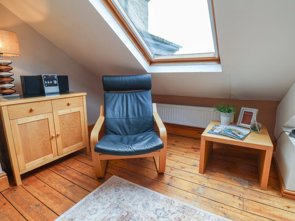 A snug with a chair and furniture at The Studio on the Crescent in Whitby