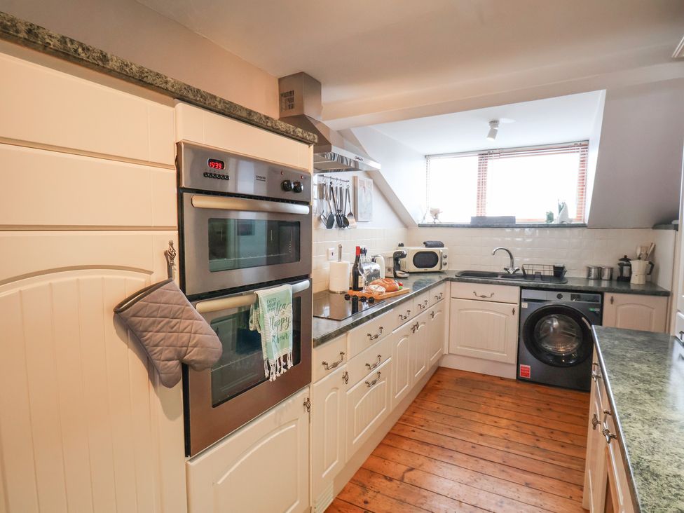 A kitchen with appliances and utensils at The Studio on the Crescent Whitby