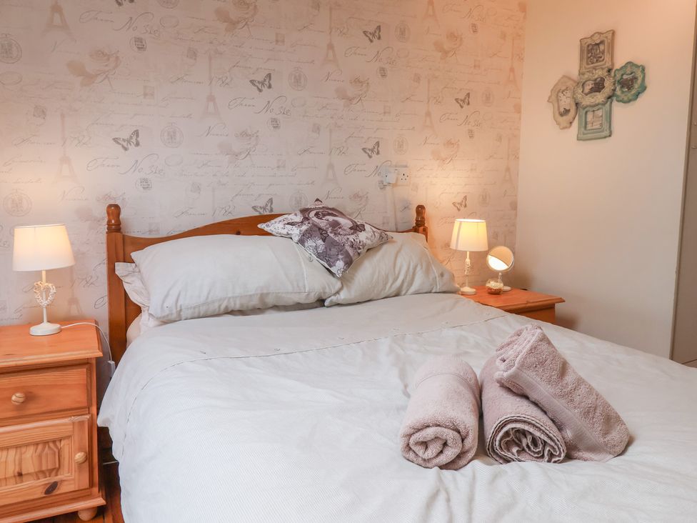 A bedroom with a bed and bedside table at The Studio on the Crescent in Whitby
