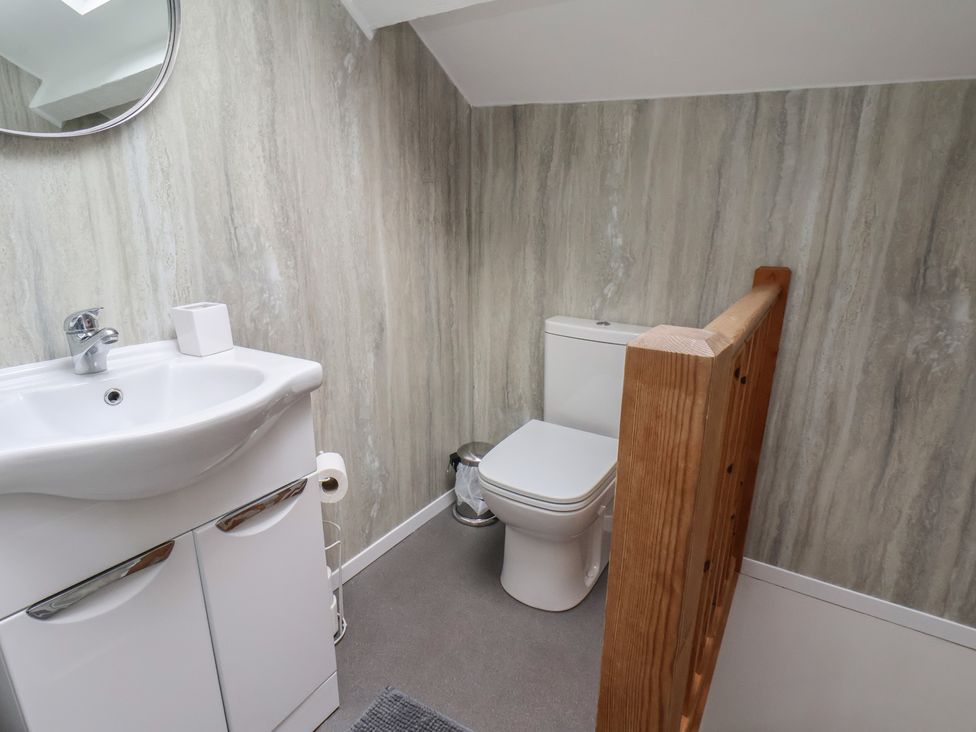 A bathroom with a sink and toilet at The Studio on the Crescent in Whitby