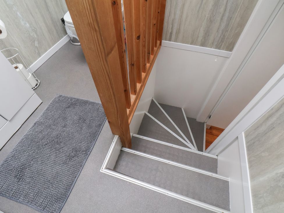 A bathroom with stairs and a toilet at The Studio on the Crescent in Whitby