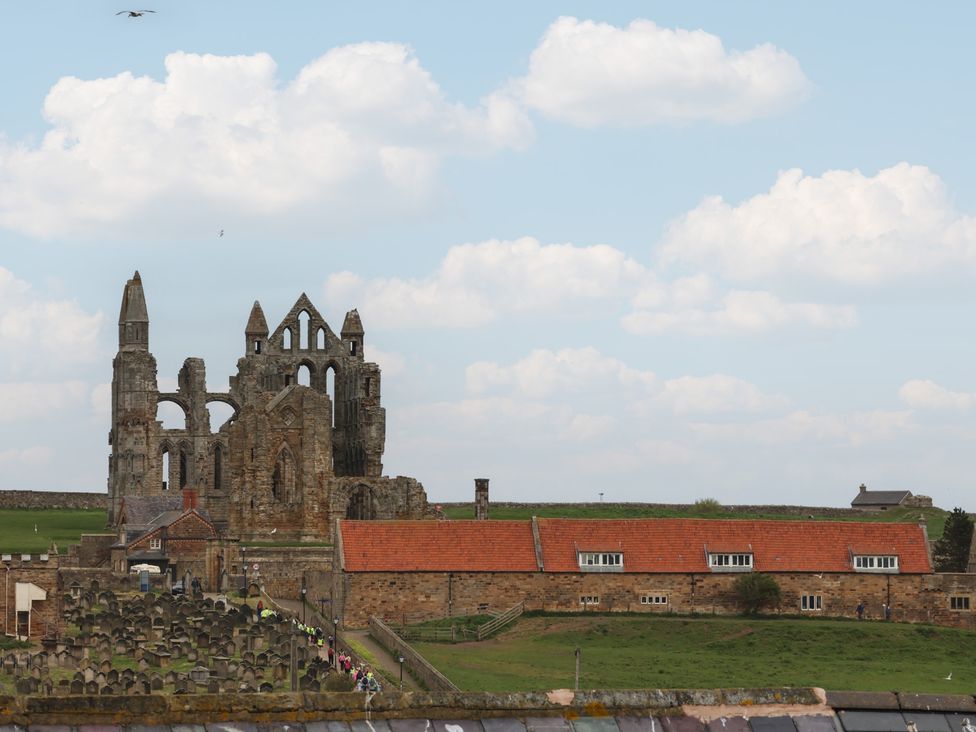 Ruins with graveyard and buildings at The Studio on the Crescent Whitby