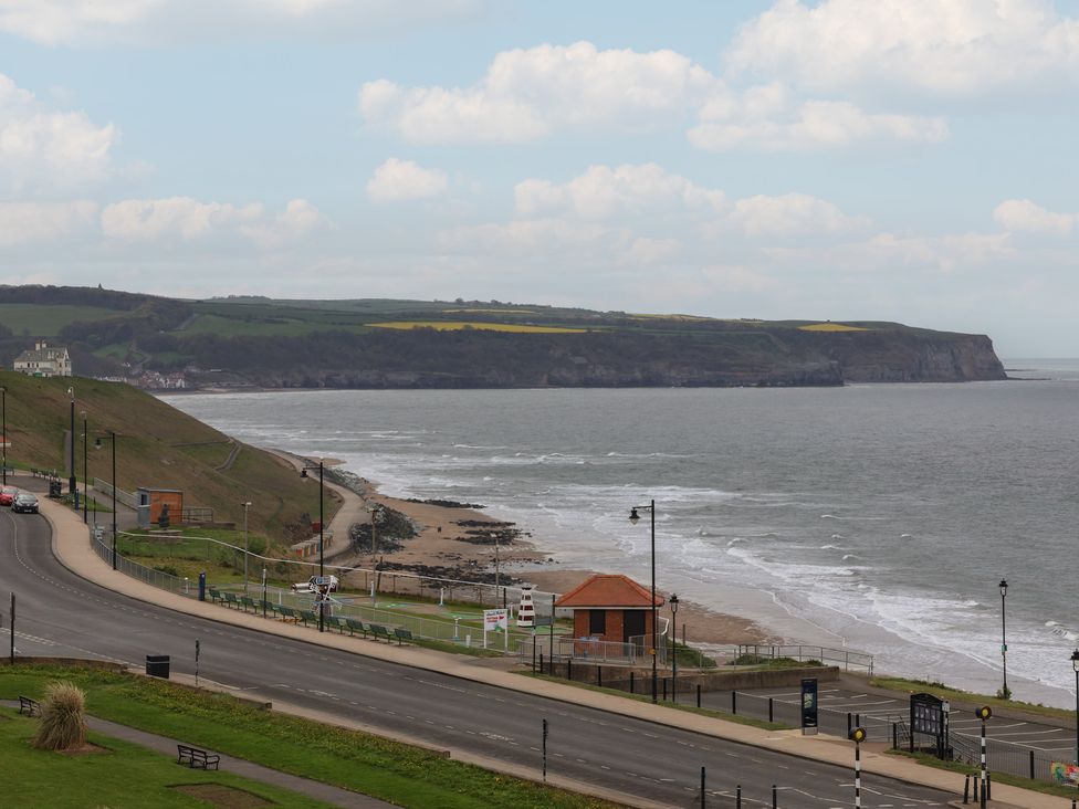A view of the ocean and shore with cliffs at The Studio on the Crescent Whitby