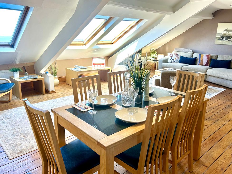 A dining room with a table and chairs at The Studio on the Crescent in Whitby