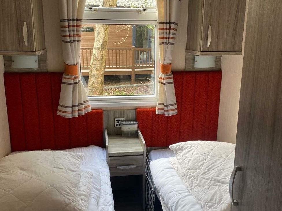 a bedroom with two single beds and a window at Wild Duck Holiday Park - Holiday Accommodation 10389 Nr Great Yarmouth