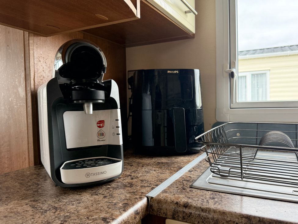 A coffee machine and air fryer on the kitchen counter at Cala Gran Holiday Park - Holiday Accommodation 10830 in Fleetwood