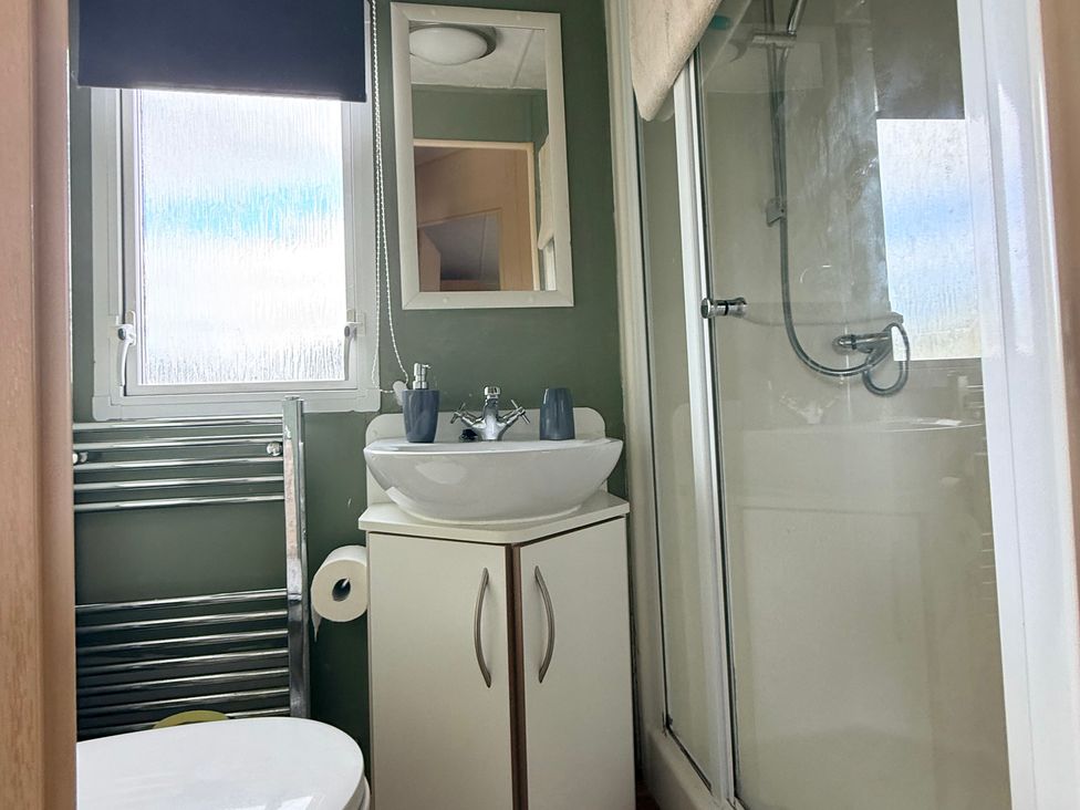 A bathroom with toilet, sink, and shower at Cala Gran Holiday Park - Holiday Accommodation 10830 in Fleetwood