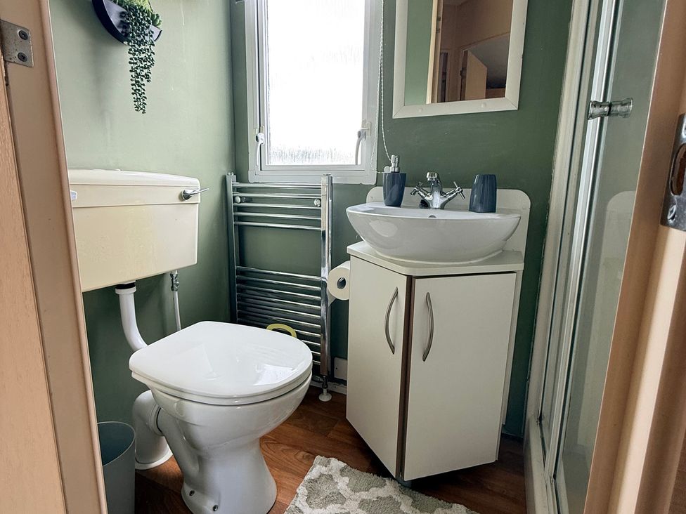 A bathroom with a sink and toilet at Cala Gran Holiday Park - Holiday Accommodation 10830 Fleetwood