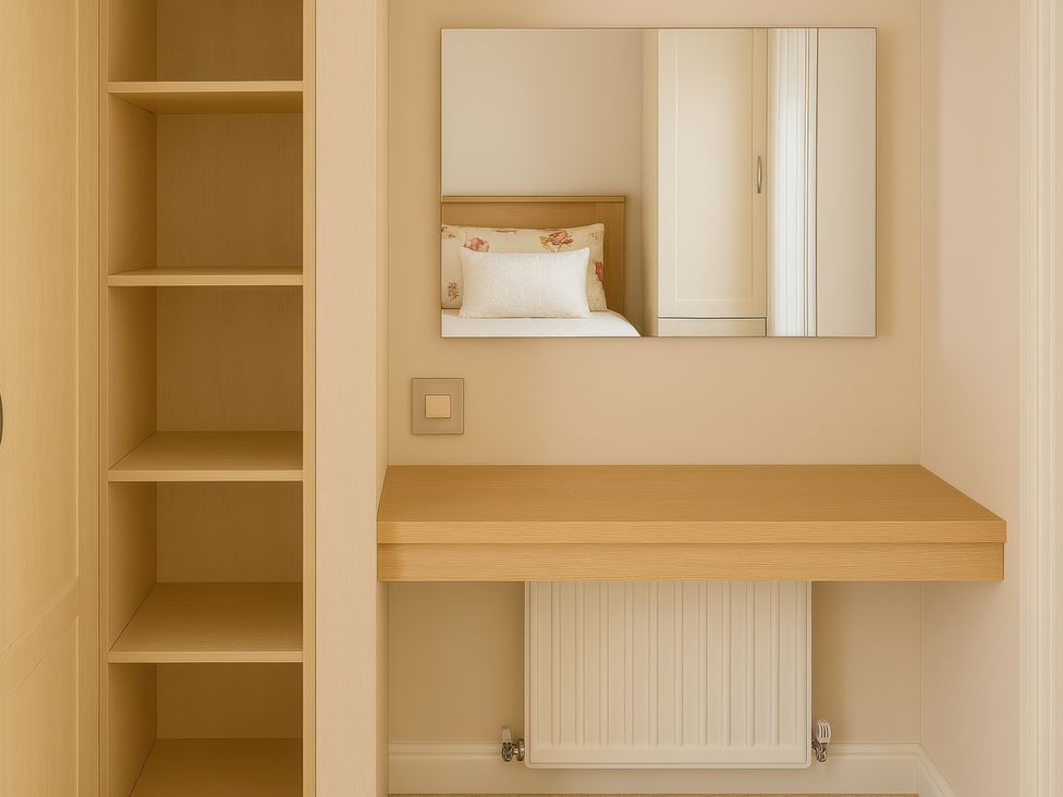 A dressing room with shelves and a mirror at Combe Haven Holiday Park - Holiday Accommodation 12122 St. Leonards-on-Sea