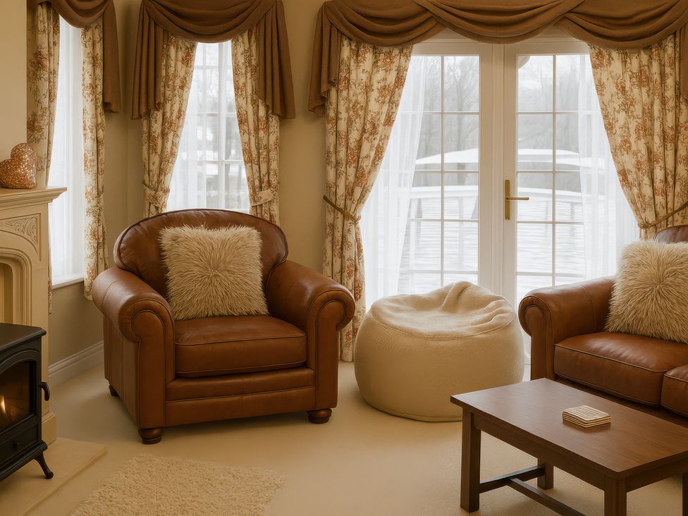 A living room with an armchair and a bean bag at Combe Haven Holiday Park - Holiday Accommodation 12122 in St. Leonards-on-Sea