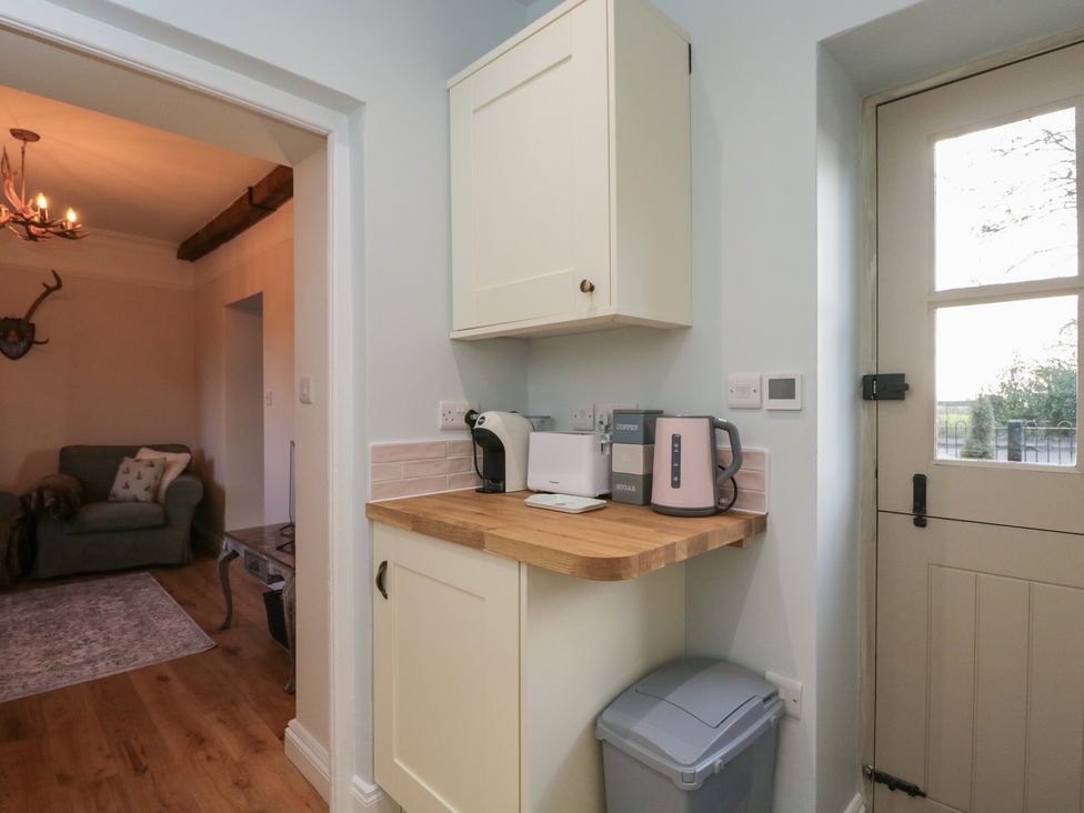 A kitchen with appliances on the counter at Maud Heath's Snug in Chippenham