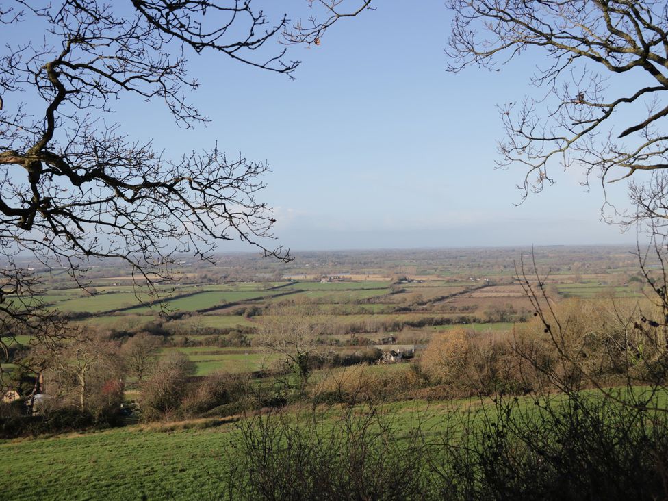 A view of fields and trees at Maud Heath's Snug in East Thytherton