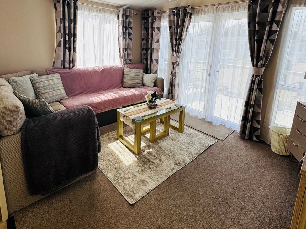 A living room with a sofa and coffee table at Golden Palm Resort - Holiday Accommodation 13363 Skegness