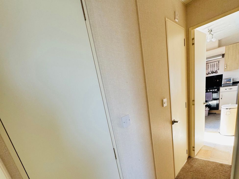 A hallway leading to a kitchen at Golden Palm Resort - Holiday Accommodation 13363, Skegness