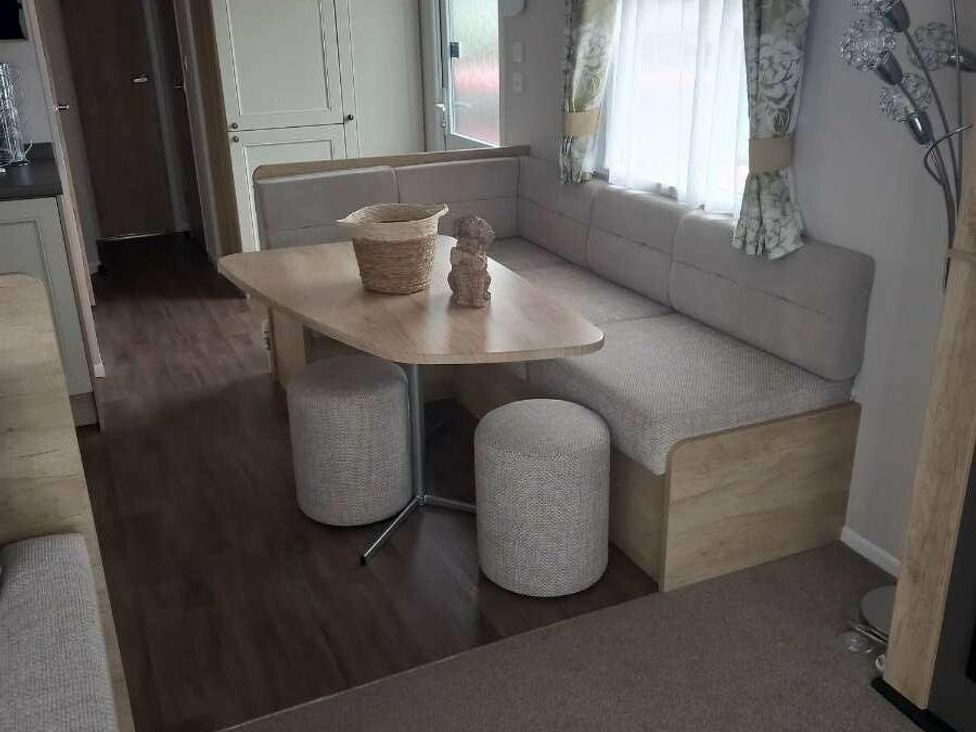 a dining area with a table and seating at Skegness Holiday Park - Holiday Accommodation 13968 Skegness