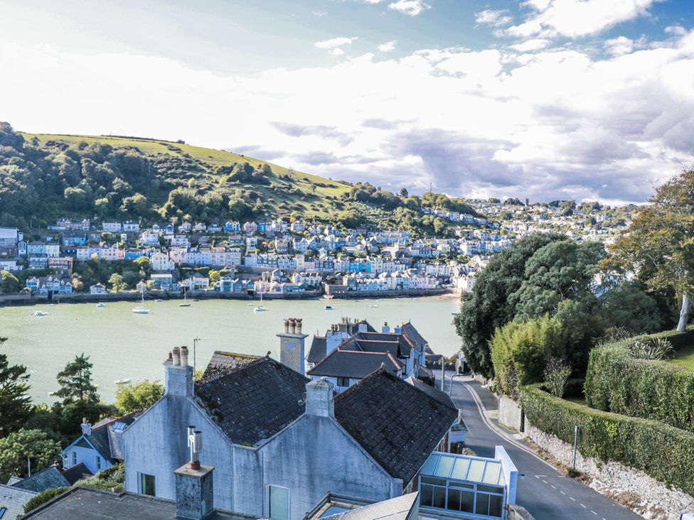 A view of houses and water with boats at Fastnet at Nonsuch House Dartmouth