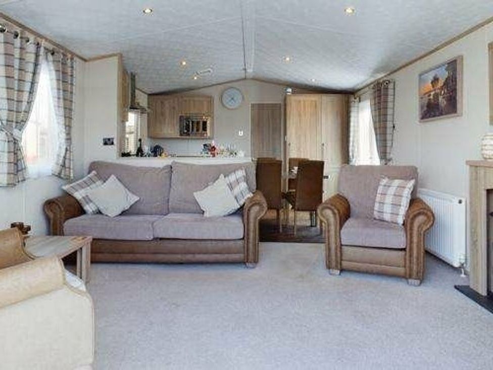 a living room with two sofas and a dining area at Tattershall Lakes Country Park - Holiday Accommodation 16408 in Tattershall