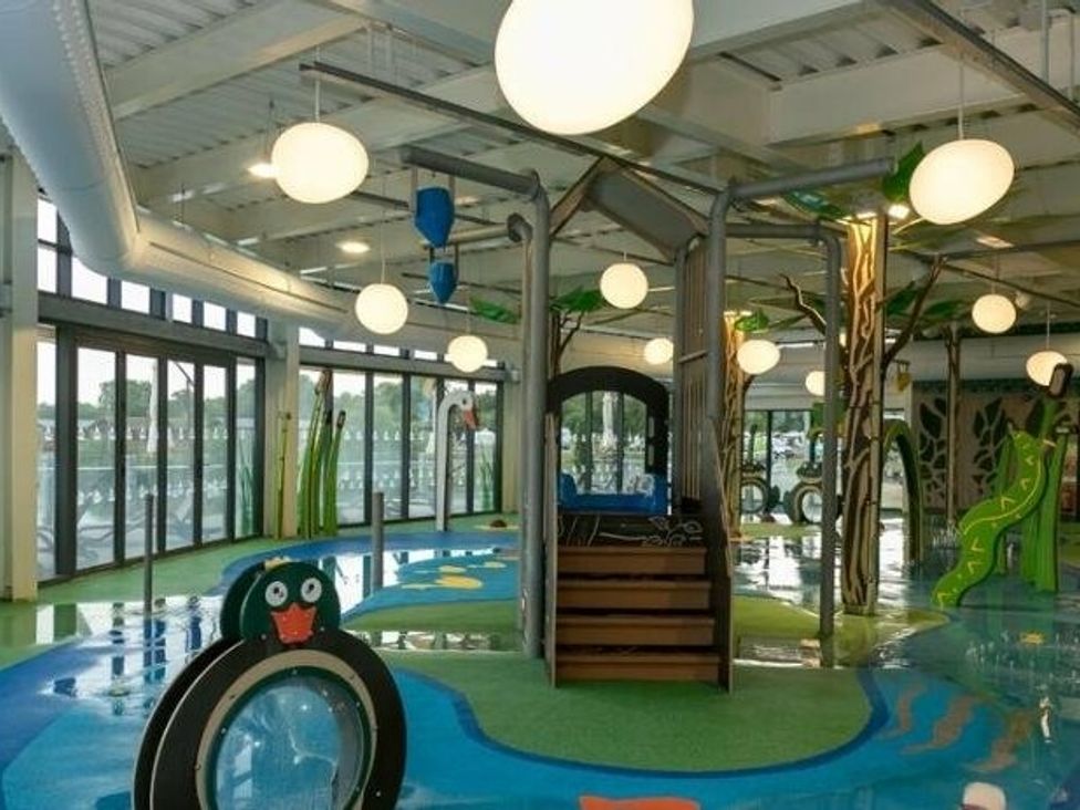 a play area with colorful water features and slides at Tattershall Lakes Country Park - Holiday Accommodation 16408, Tattershall