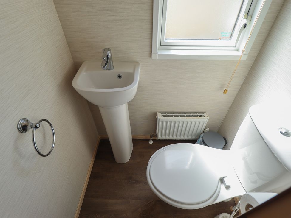 A bathroom with a sink and toilet at Tattershall Lakes Country Park - Holiday Accommodation 16408 in Tattershall