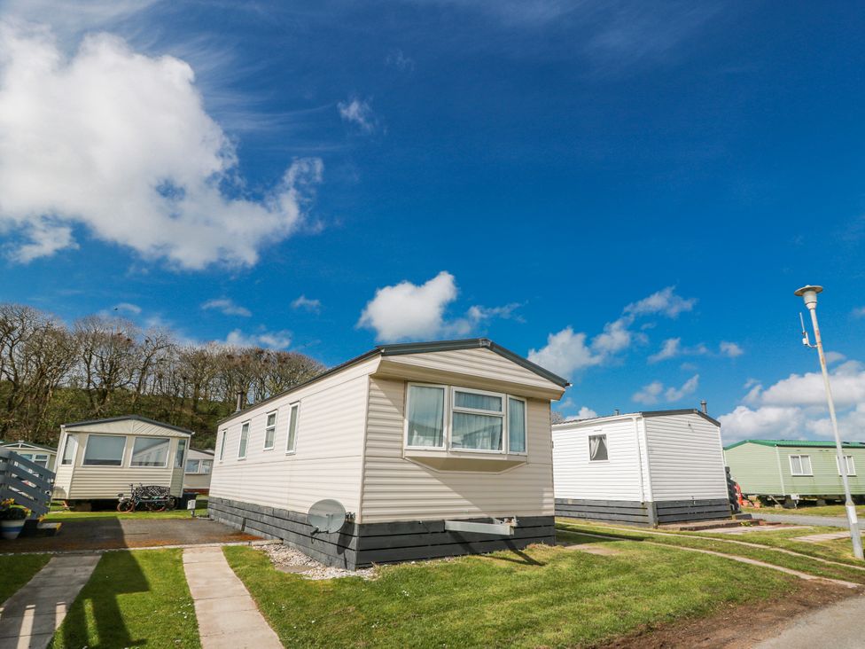 A mobile home park with several homes and a pathway at WigBay Holiday Park - Holiday Accommodation 16774 in Stranraer