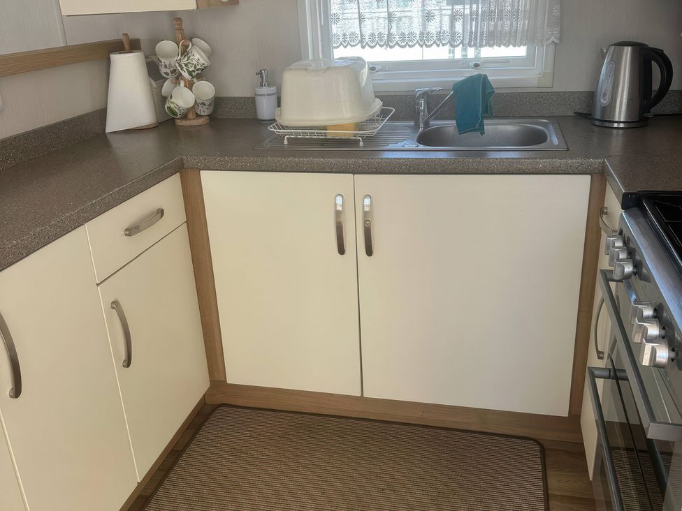 A kitchen with a sink and countertop at Freshwater Beach Holiday Park - Holiday Accommodation 17116 near Burton Bradstock