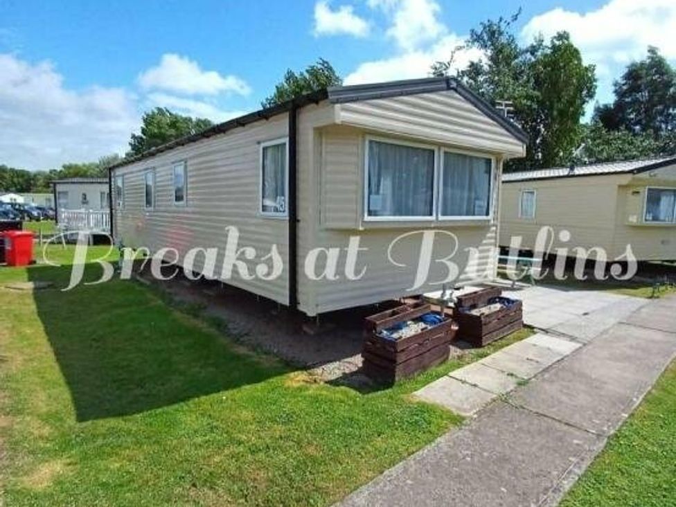 a static caravan with windows and a pathway at Butlins Minehead - Holiday Accommodation 18045 in Minehead