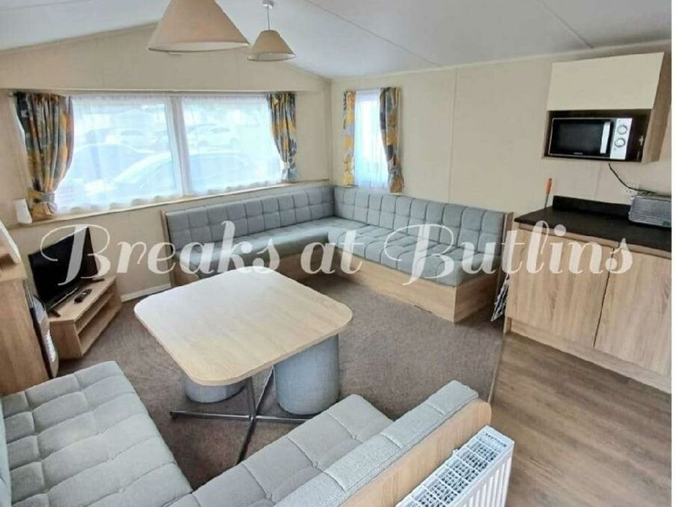 a living room with gray seating and a round table at Butlins Minehead - Holiday Accommodation 18045 in Minehead