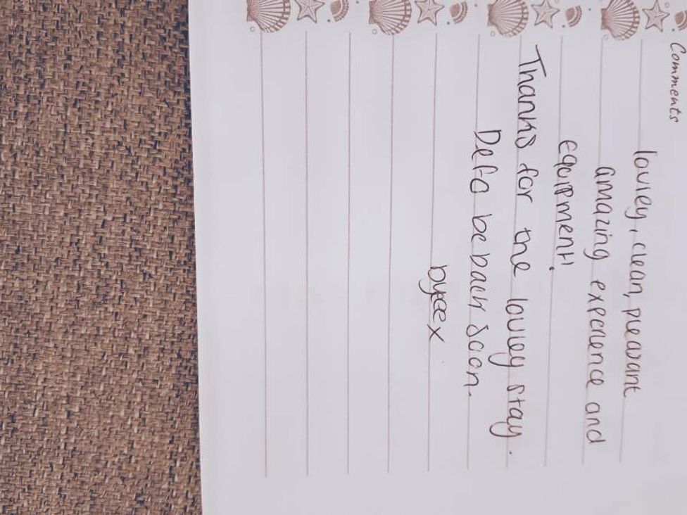 a handwritten note expressing thanks for a lovely stay at an unknown location