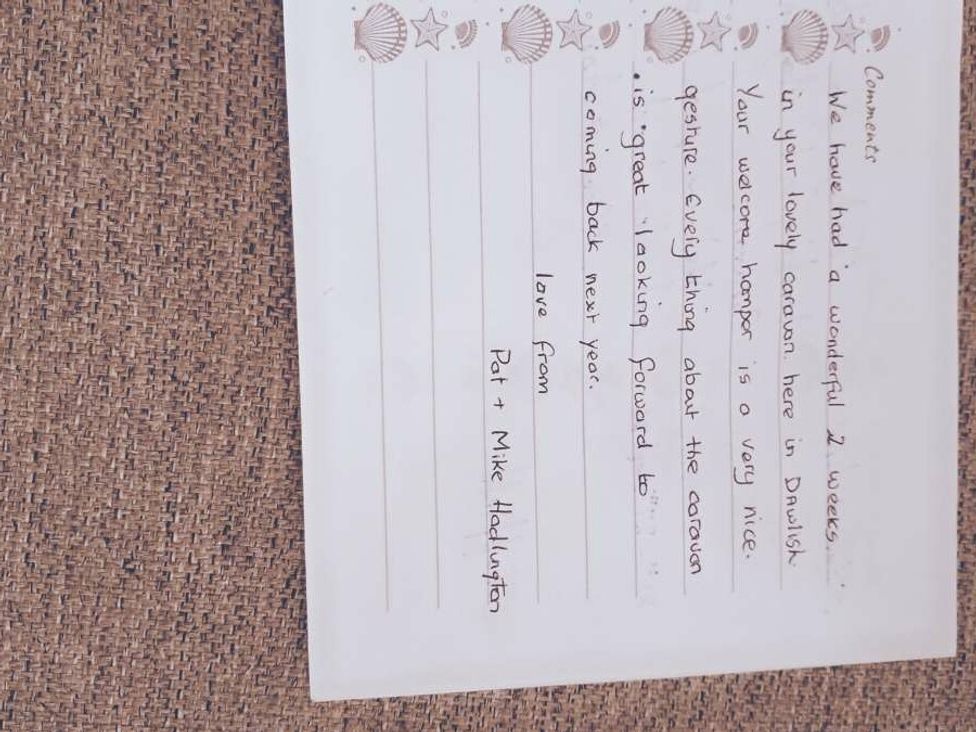 a handwritten comment card expressing satisfaction about a holiday stay at Golden Sands Holiday Park - Holiday Accommodation 18951 in Dawlish