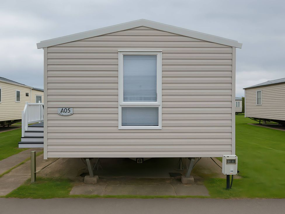 A static caravan with a window at Whitehouse Leisure Park - Holiday Accommodation 19055 Towyn, Abergele