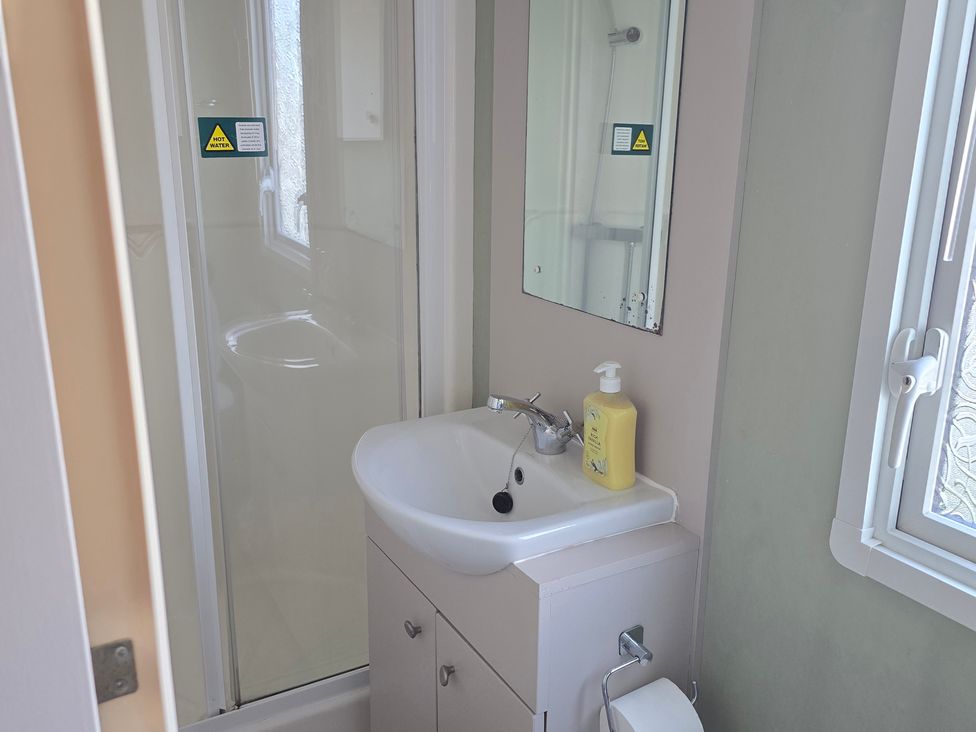 A bathroom with a sink and shower at Littlesea Holiday Park - Holiday Accommodation 19270 in Weymouth