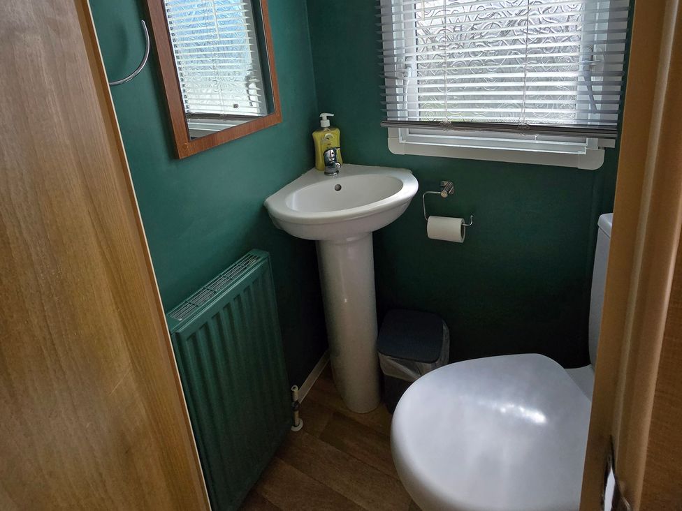 A bathroom with a sink and toilet at Littlesea Holiday Park - Holiday Accommodation 19270, Weymouth