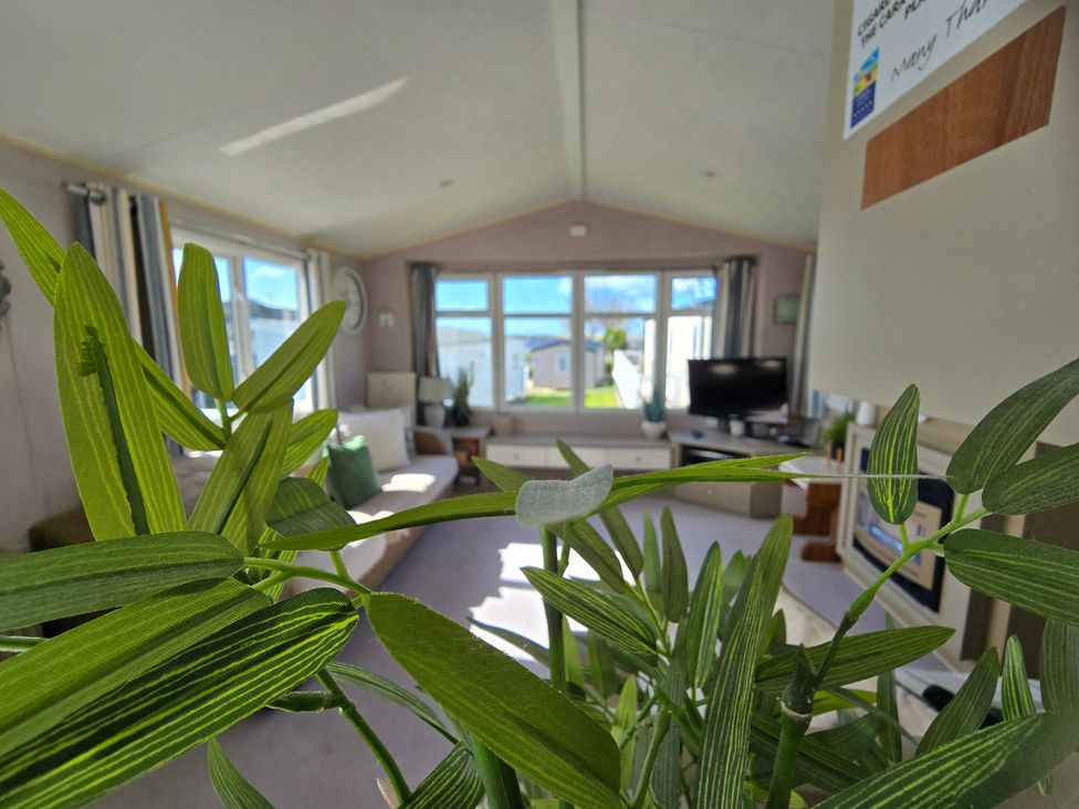 A living room with a view of a sofa and television at Littlesea Holiday Park - Holiday Accommodation 19270, Weymouth