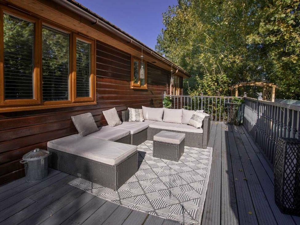a seating area with cushions on a deck at Florida Keys Holiday Park - Holiday Accommodation 19291 in York