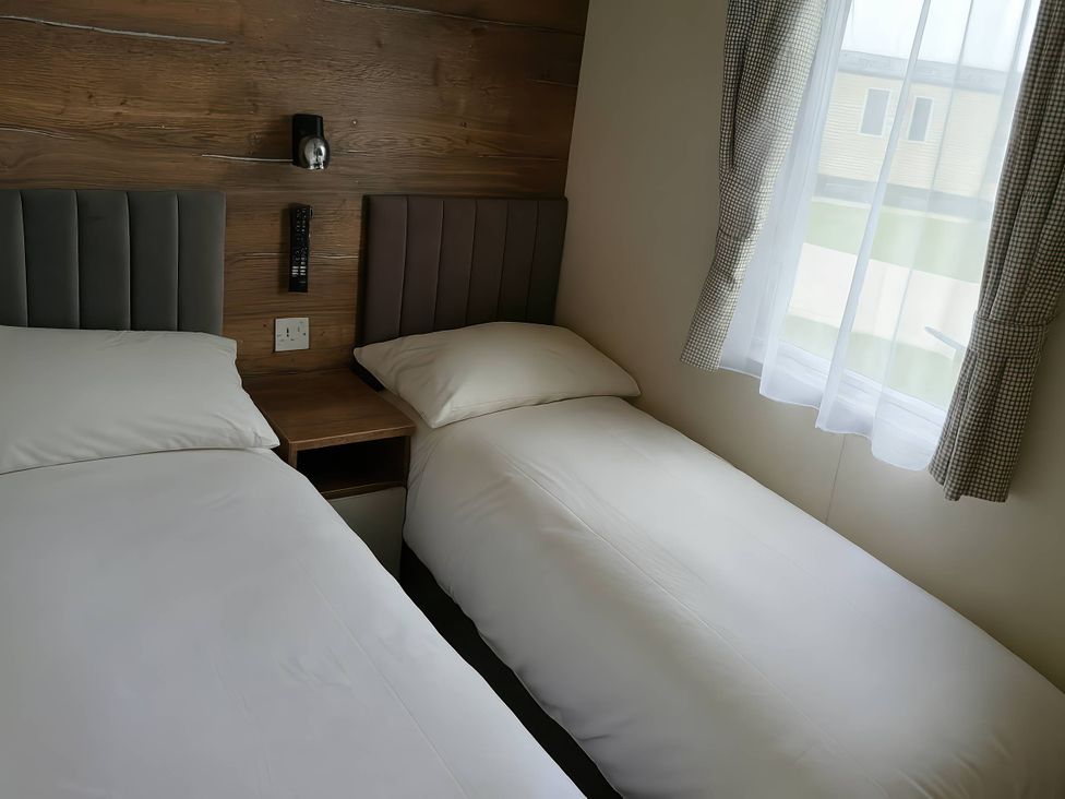 A bedroom with two single beds at Lakeland Leisure Park - Holiday Accommodation 20349 Grange-Over-Sands